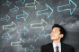 Man with arrows on a blackboard